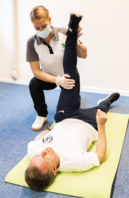 Heidi helping a client during a Physiotherapy and Injury Rehabilitation session